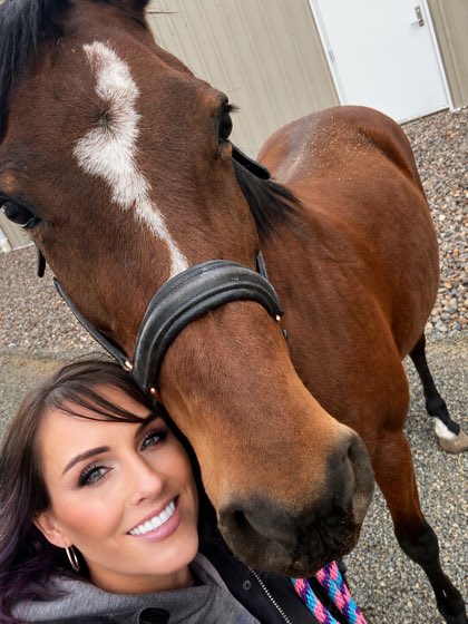 Kristin with her horse at the barn
